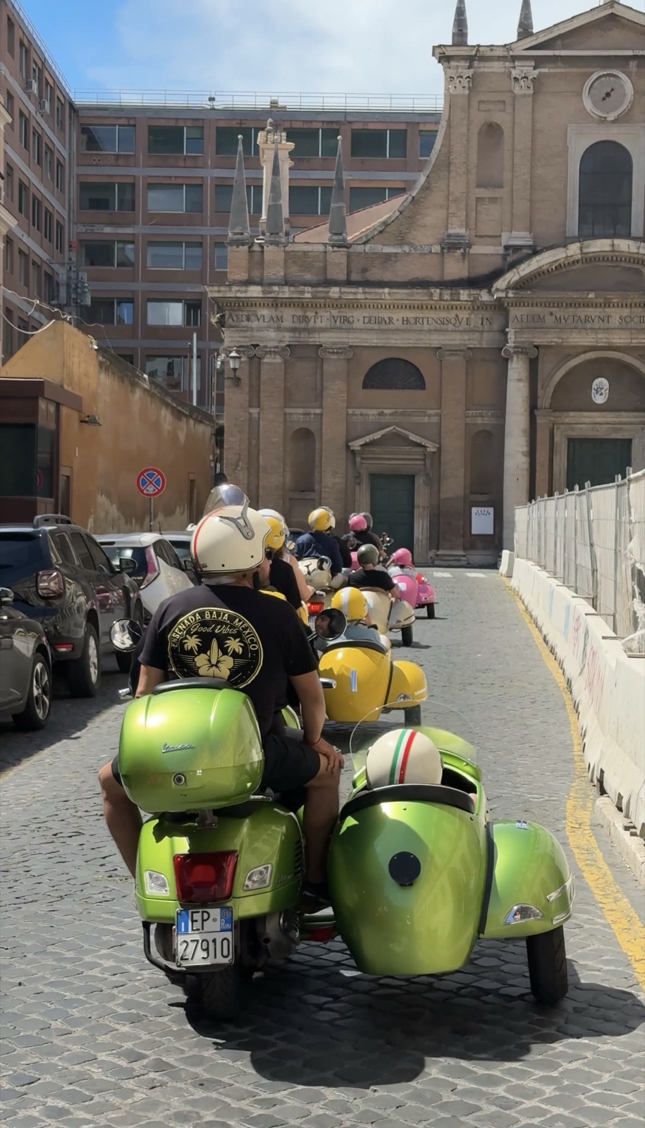 Vespa sidecar under a bridge near the Colosseum